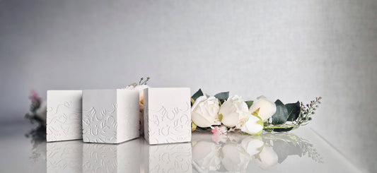 Elegant spring wedding table setting featuring The Opulent’s sculptural vessels with lush floral centerpieces, embodying timeless sophistication and charm.